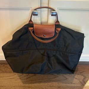 Longchamp foldable tote.  Shoulder and hand strap, black and large in capacity.